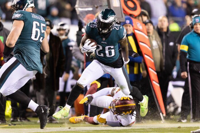 Philadelphia Eagles RB Miles Sanders (26) breaks a tackle against Washington.