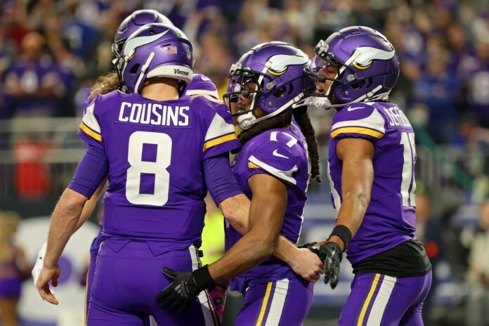 Minnesota Vikings players celebrate after scoring a touchdown.