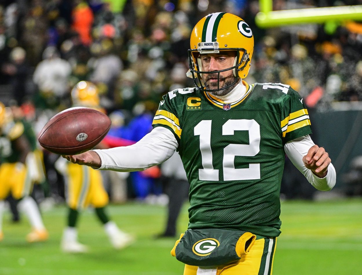 Green Bay Packers quarterback Aaron Rodgers warms up before a game at Lambeau Field.