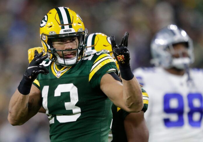 Allen Lazard celebrates a long first down gain on a reception in overtime against the Dallas Cowboys.