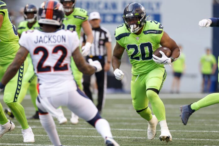 Seattle Seahawks RB Rashaad Penny (20) runs with the ball against Denver.