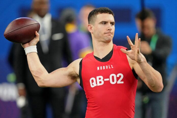 Stetson Bennett participates in drills at Lucas Oil Stadium.