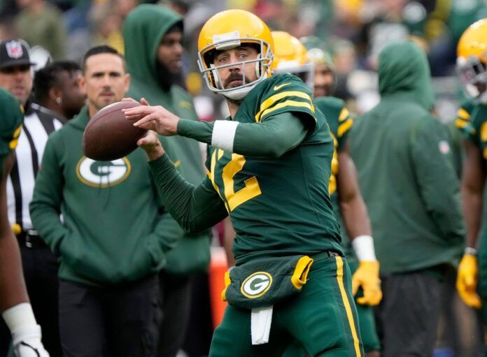 Aaron Rodgers warms up before the Green Bay Packers play the New York Jets.