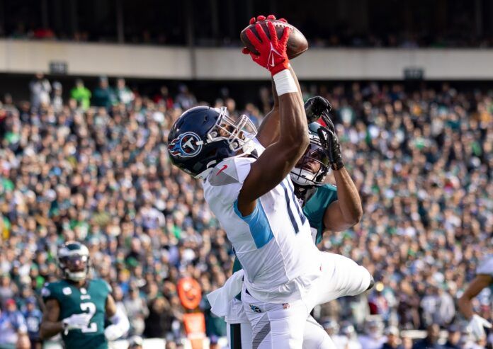 Tennessee Titans WR Treylon Burks (16) goes up for the catch against Jacksonville.