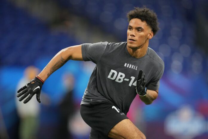 Christian Gonzalez participates in drills at Lucas Oil Stadium.