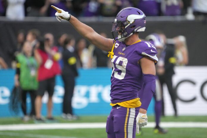 Minnesota Vikings WR Adam Thielen (19) points in celebration.