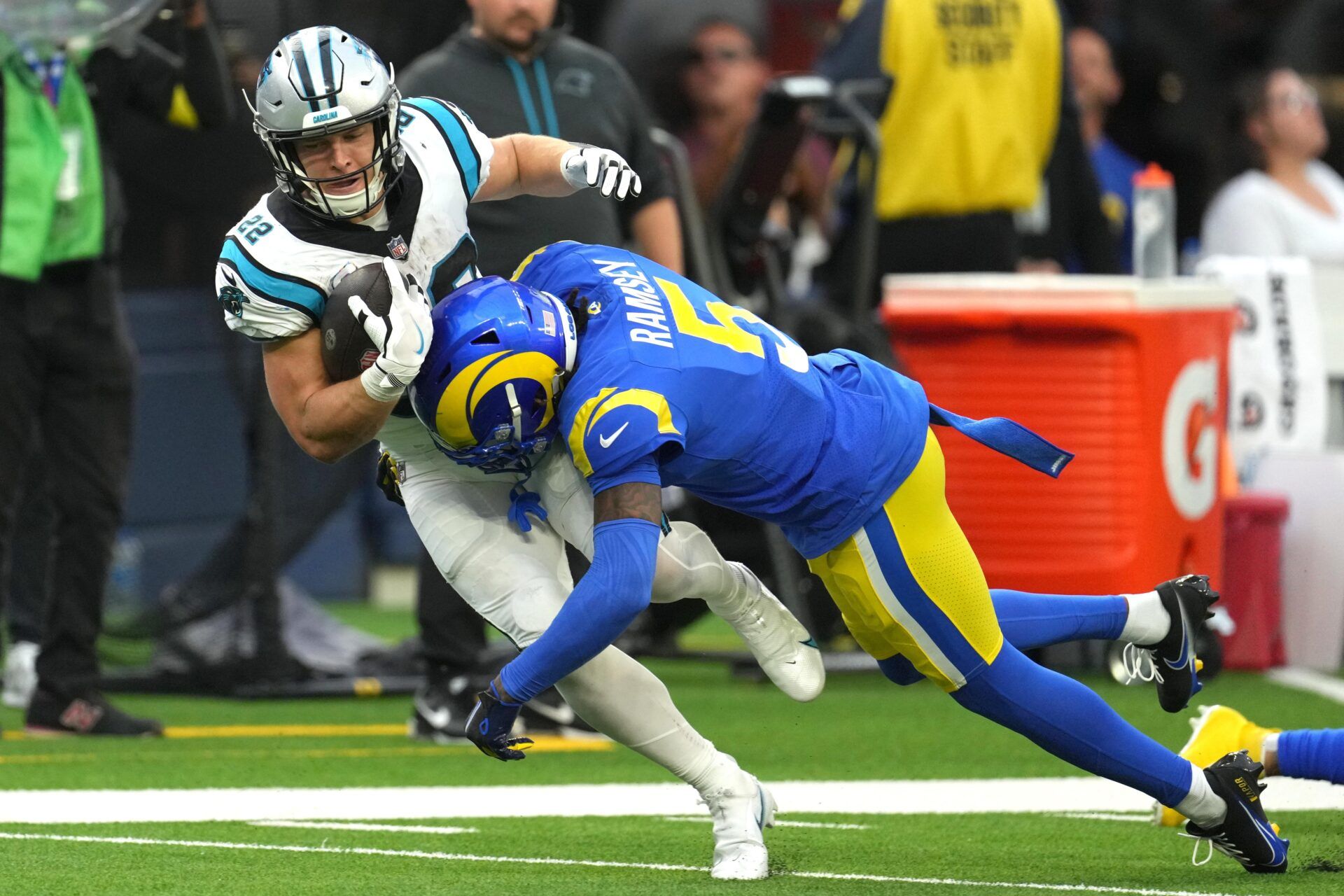 Los Angeles Rams CB Jalen Ramsey (5) tackles Carolina Panthers RB Christian McCaffrey (22).