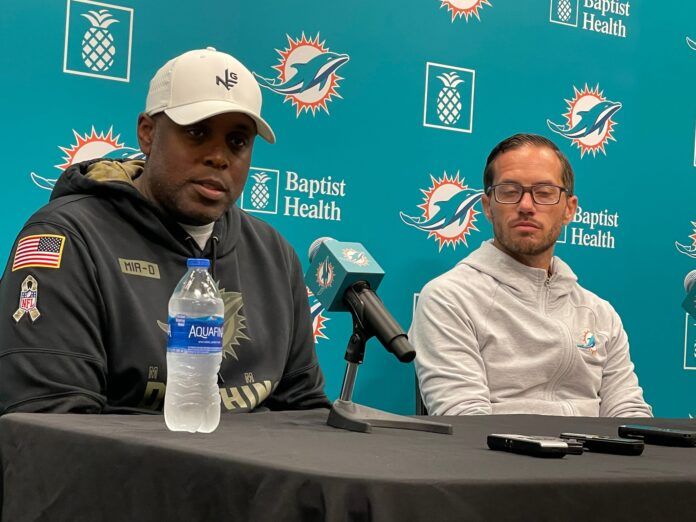 Miami Dolphins general manager Chris Grier (left) and head coach Mike McDaniel (right) address reporters.