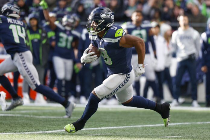 Kenneth Walker III rushes against the New York Jets during the first quarter.