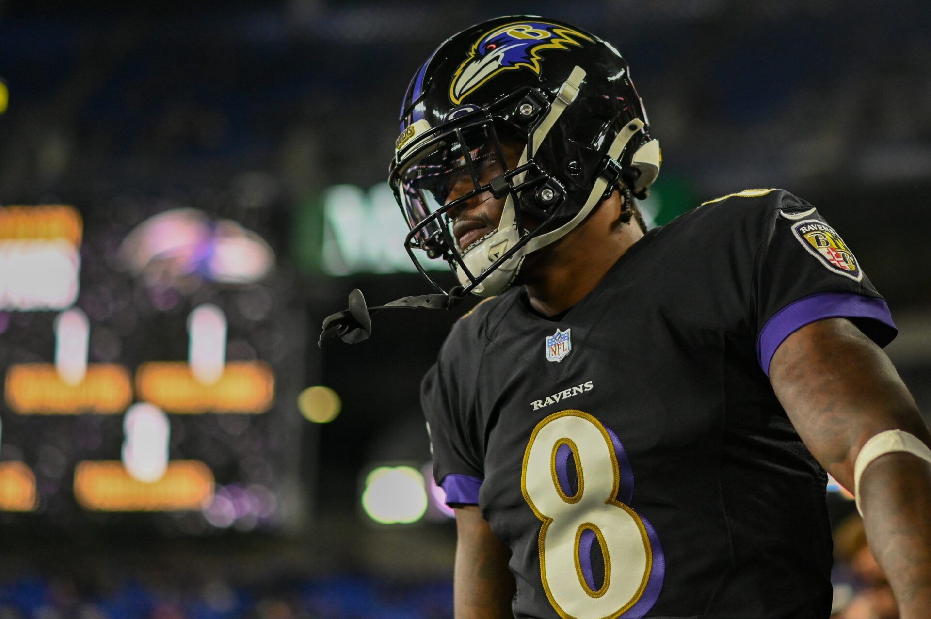 Baltimore Ravens quarterback Lamar Jackson (8) stands in the sidelines before the game against the Cincinnati Bengals at M&T Bank Stadium.