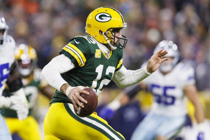 Green Bay Packers quarterback Aaron Rodgers (12) runs during a game against the Dallas Cowboys.