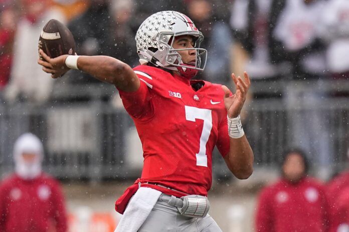 Ohio State quarterback C.J. Stroud steps back to attempt a pass.