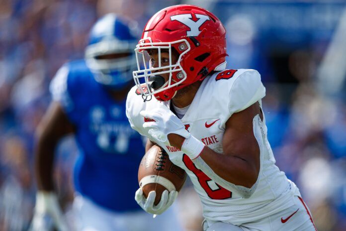 Jaleel McLaughlin runs the ball during the first quarter against the Kentucky Wildcats.