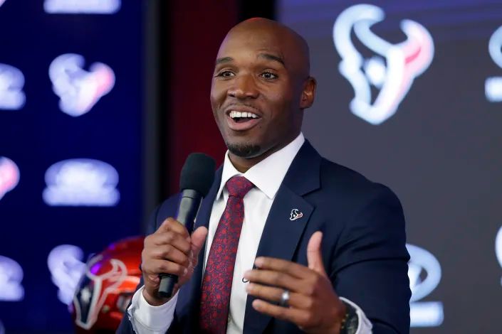 DeMeco Ryans answers questions at NRG Stadium.