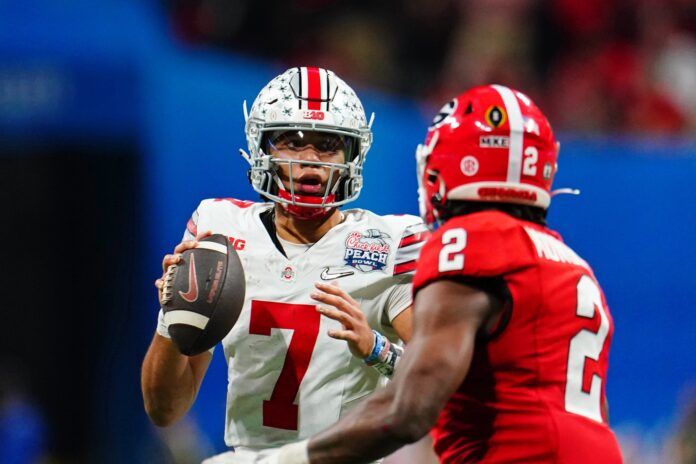 Ohio State QB C.J. Stroud (7) looks to pass against Georgia in the College Football Playoff.