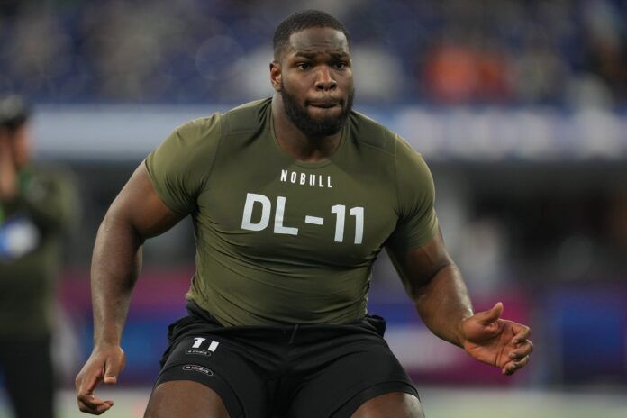 Texas defensive lineman Moro Ojomo participates in the NFL Combine at Lucas Oil Stadium.