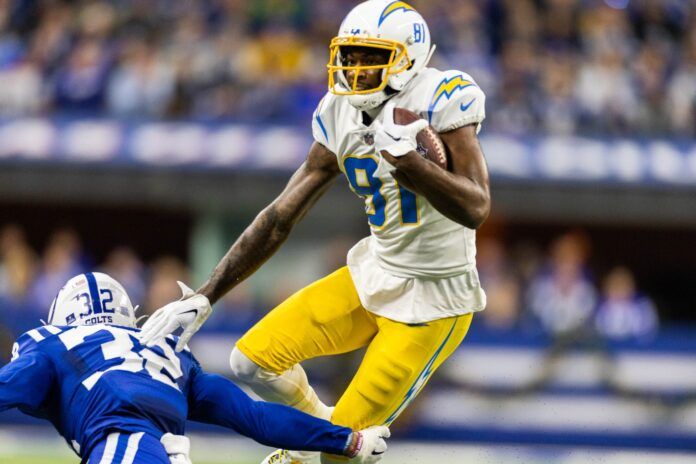 Los Angeles Chargers WR Mike Williams (81) runs with the ball and looks to avoid the tackle against Indianapolis.