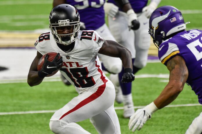 Atlanta Falcons WR Calvin Ridley (18) attempts to elude the Vikings defense.