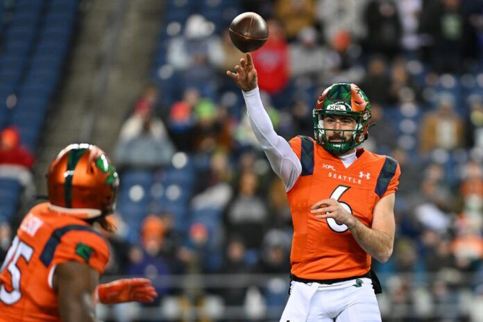 Seattle Sea Dragons QB Ben DiNucci (6) passes the ball to RB Morgan Ellison (25).