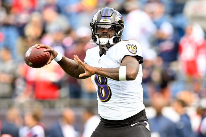 Lamar Jackson prepares to throw the ball during warmups.