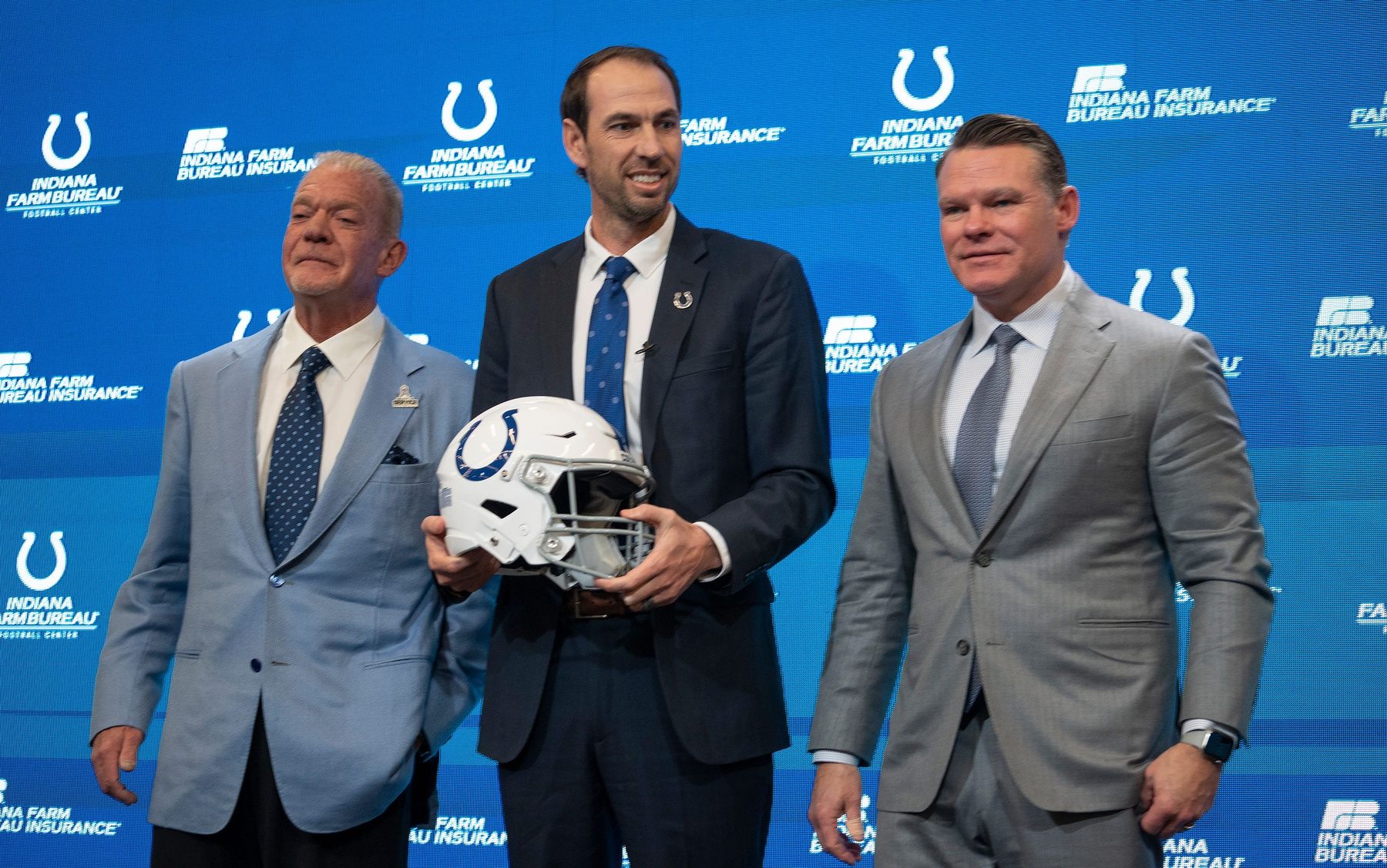 Shane Steichen poses for photos with Colts Owner and CEO Jim Irsay and General Manager Chris Ballard after a press conference.