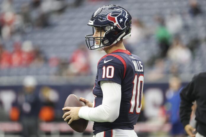 Davis Mills warms up before the game against the Kansas City Chiefs.