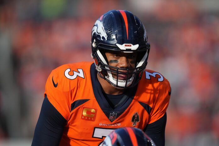 Denver Broncos quarterback Russell Wilson (3) lines up for a play and prepares for the snap.