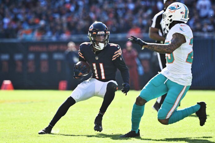 Chicago Bears WR Darnell Mooney (11) runs after the catch against the Dolphins.