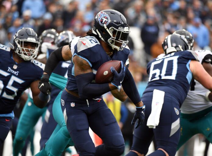 Derrick Henry runs for a short gain during the first half against the Jacksonville Jaguars.