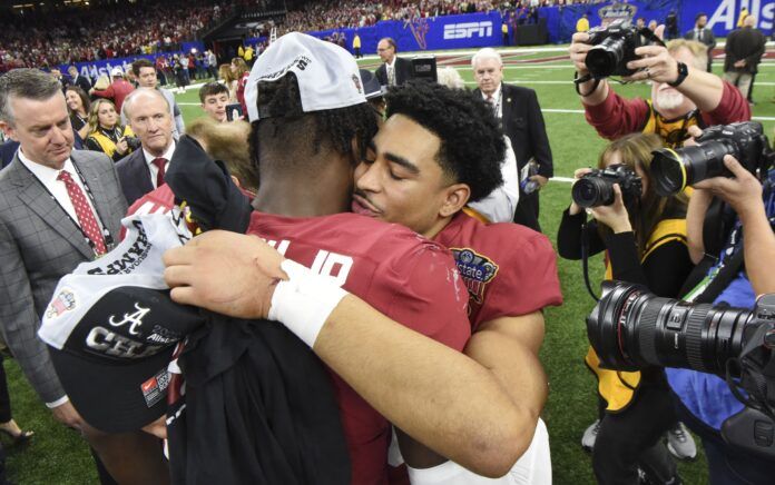 Alabama QB Bryce Young and LB Will Anderson Jr. hug after the Sugar Bowl.