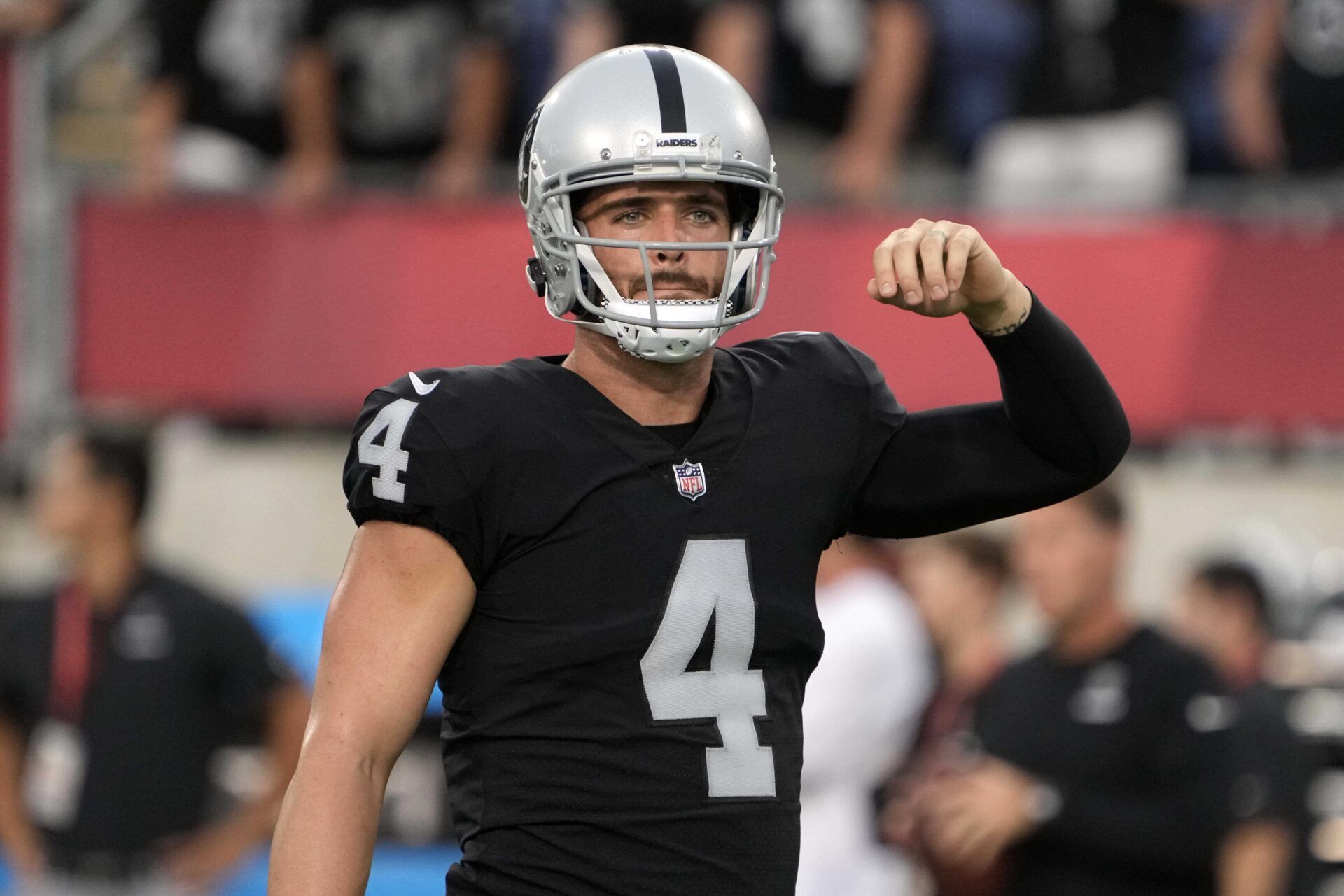 Derek Carr gestures during the Pro Football Hall of Fame game against the Jacksonville Jaguars.
