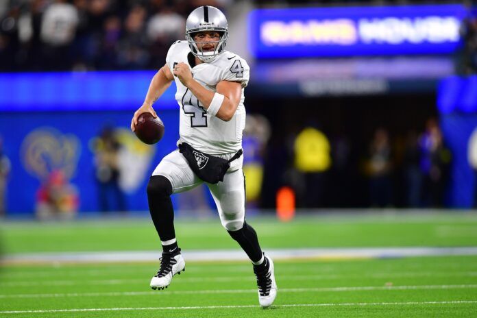 Las Vegas Raiders quarterback Derek Carr (4) runs with the ball.