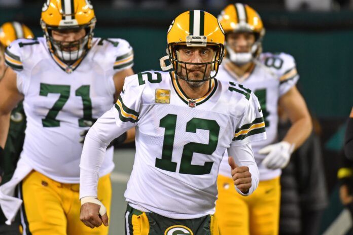 Aaron Rodgers runs on to the field against the Philadelphia Eagles.