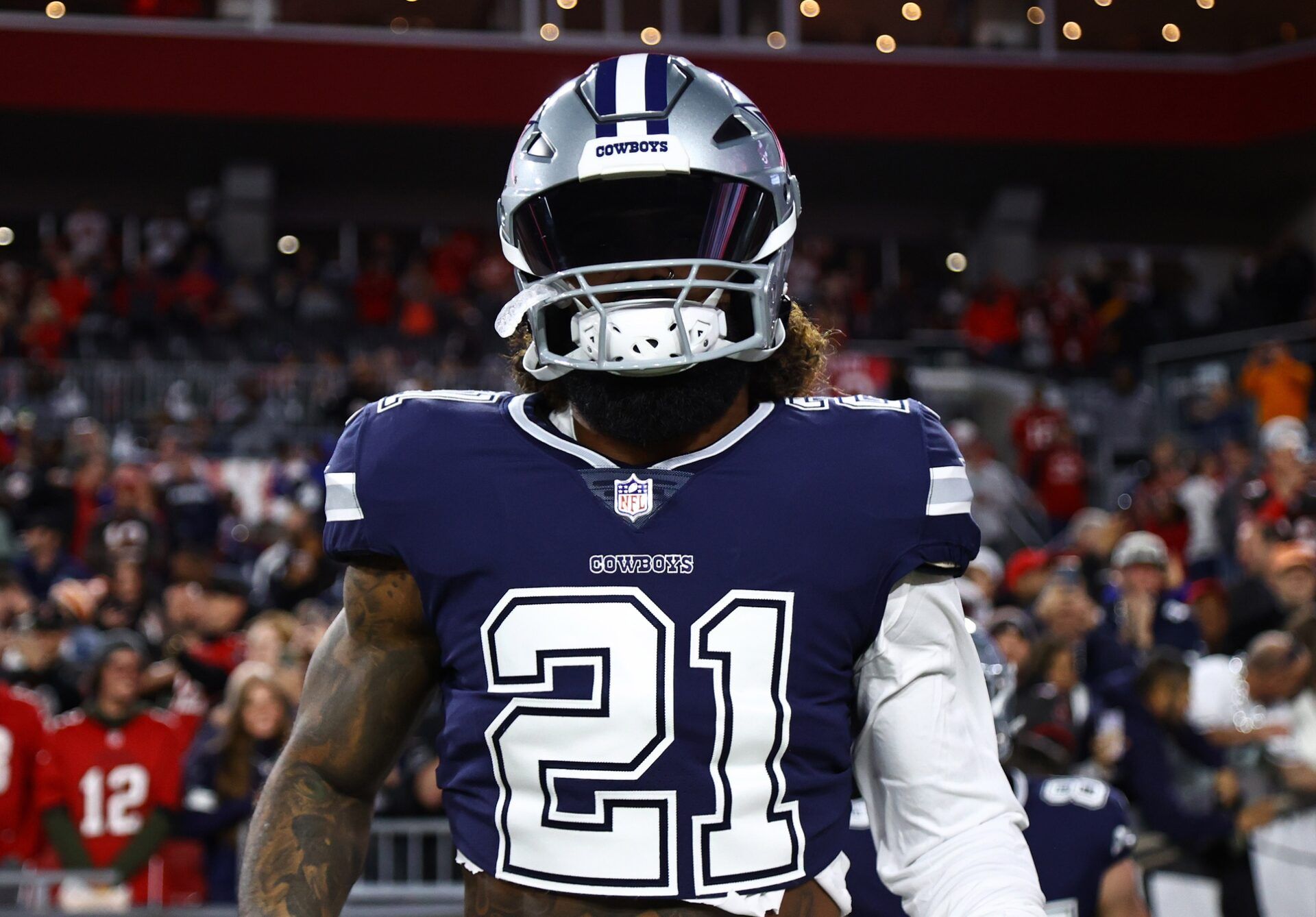 Ezekiel Elliott looks on before the Wild Card matchup against the Tampa Bay Buccaneers.