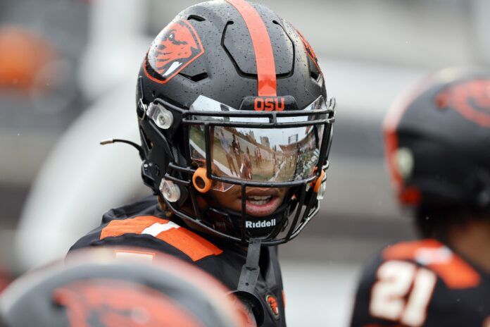 Oregon State's Alex Austin looks on.