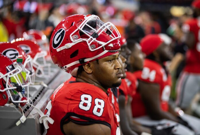 Jalen Carter sits on the sideline against TCU in the National Championship.