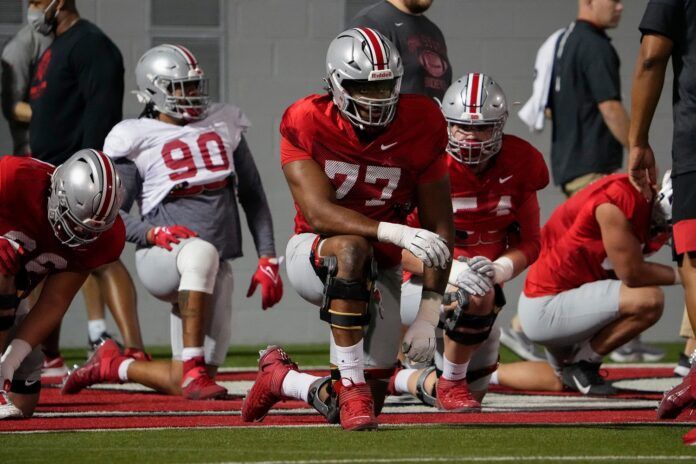 Ohio State OT Paris Johnson Jr. warms up during spring football.