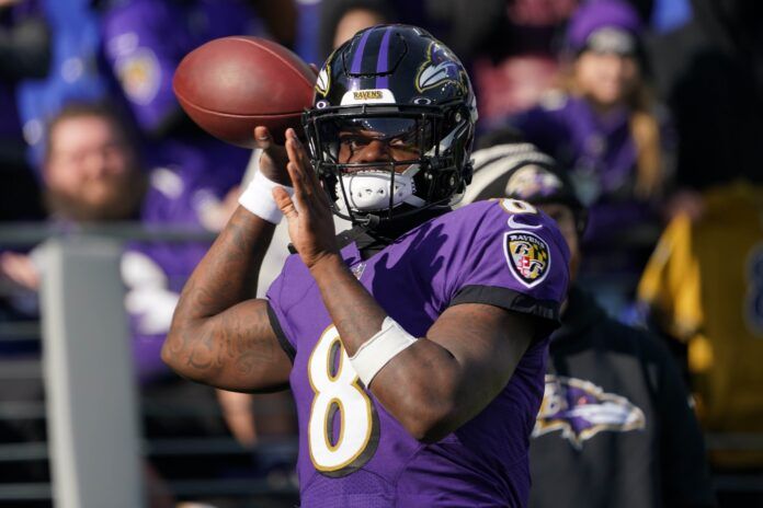 Lamar Jackson warms up before facing the Denver Broncos.