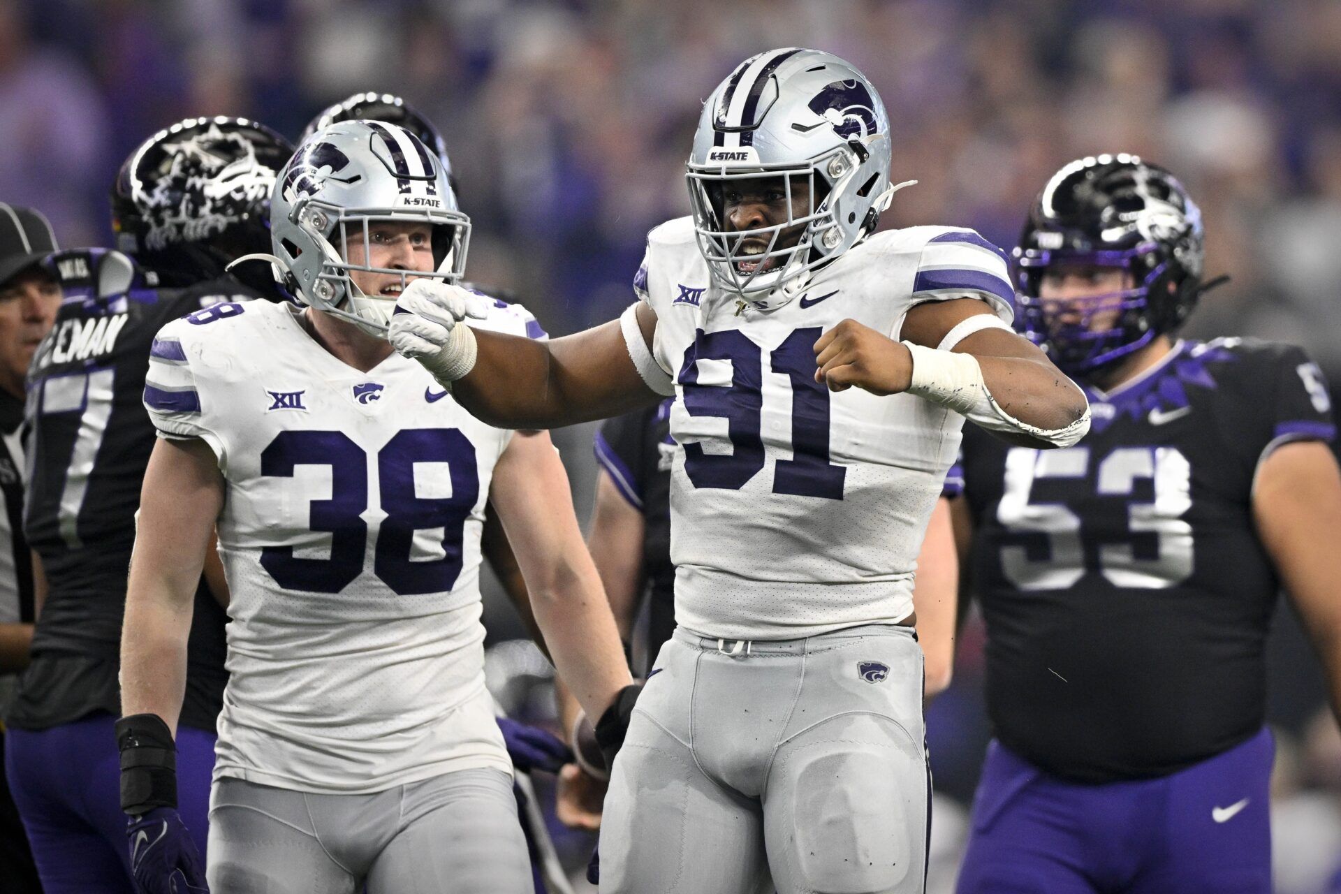 DE Felix Anudike-Uzomah celebrates after making a play against TCU.