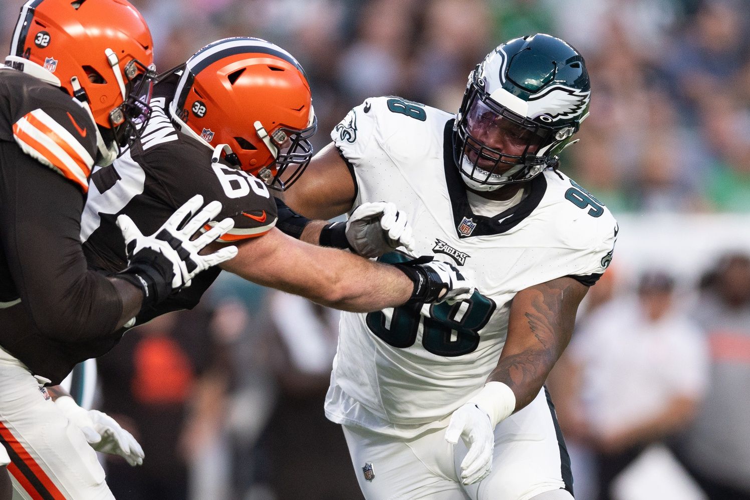 Philadelphia Eagles defensive tackle Jalen Carter (98) rushes against Cleveland Browns guard Michael Dunn (68) during the first quarter at Lincoln Financial Field.