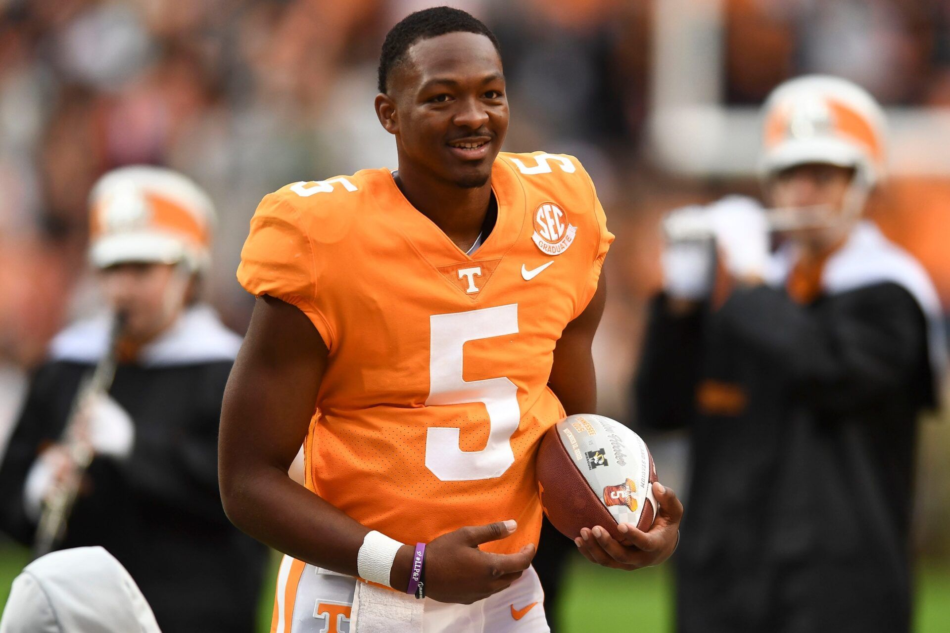 Tennessee quarterback Hendon Hooker carries the ball he was presented during a pregame ceremony recognizing the team's seniors before the game against Missouri.