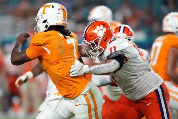 Clemson DT Bryan Bresee (11) sacks Tennessee's quarterback.