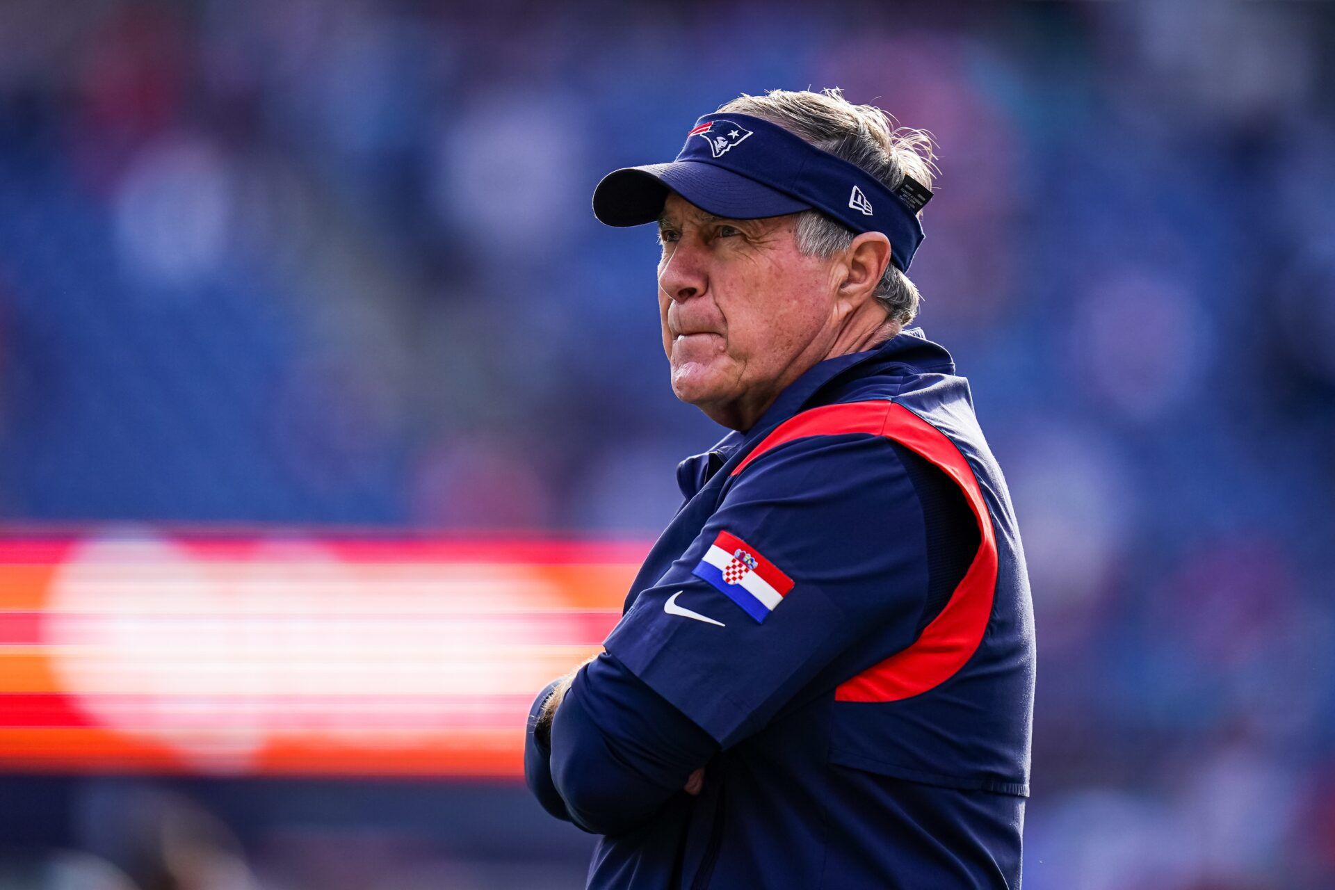 New England Patriots head coach Bill Belichick on the field for warm ups.