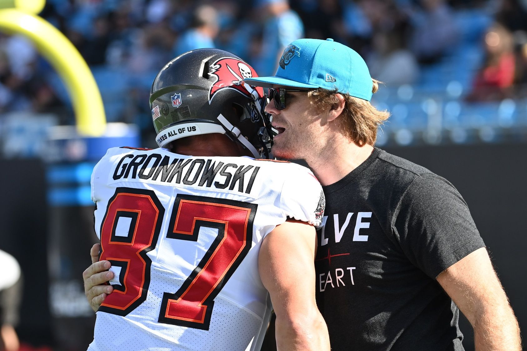 Former Carolina Panthers tight end Greg Olsen with Tampa Bay Buccaneers tight end Rob Gronkowski (87) before the game at Bank of America Stadium. 