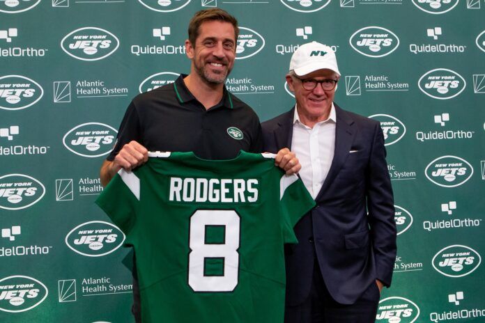 Quarterback Aaron Rodgers and New York Jets owner Woody Johnson pose for a photo during the introductory press conference.