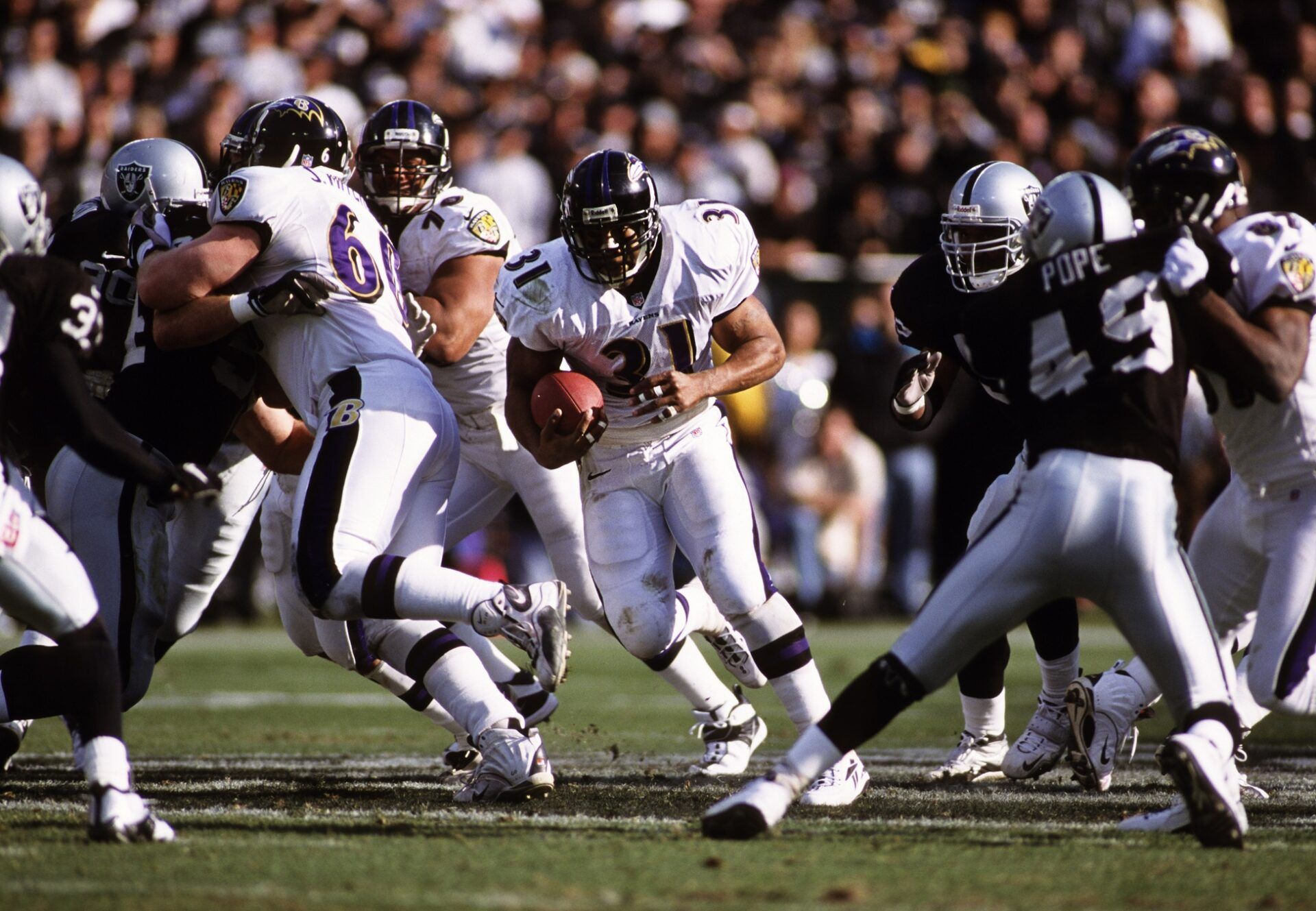 Baltimore Ravens running back Jamal Lewis (31) in action against Oakland Raiders defensive back Marquez Pope (49).