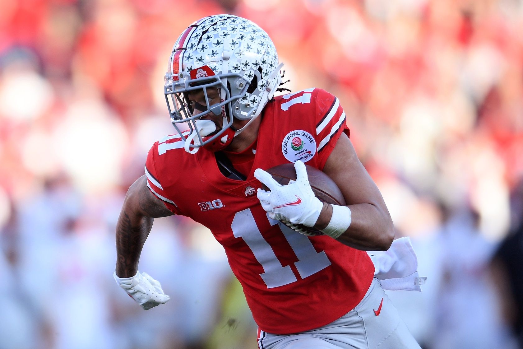 Jaxon Smith-Njigba (11) runs in the second quarter against the Utah Utes.