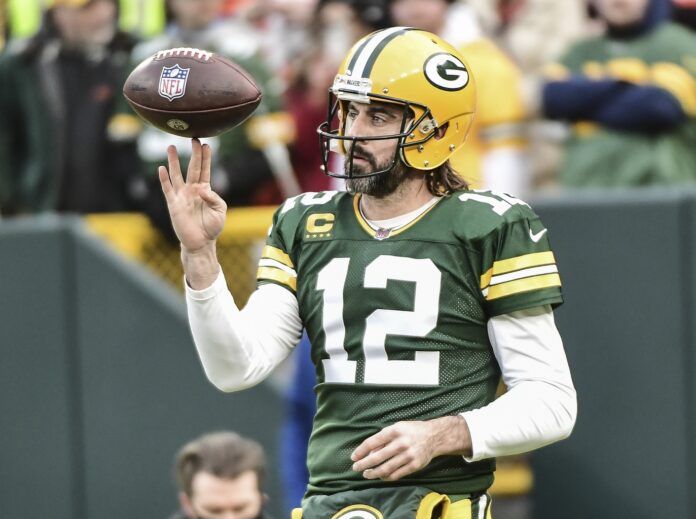 Aaron Rodgers (12) warms up before game against the Cleveland Browns at Lambeau Field.