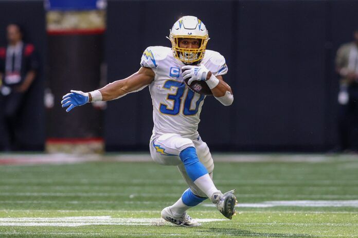 Austin Ekeler (30) runs the ball against the Atlanta Falcons in the second half at Mercedes-Benz Stadium.