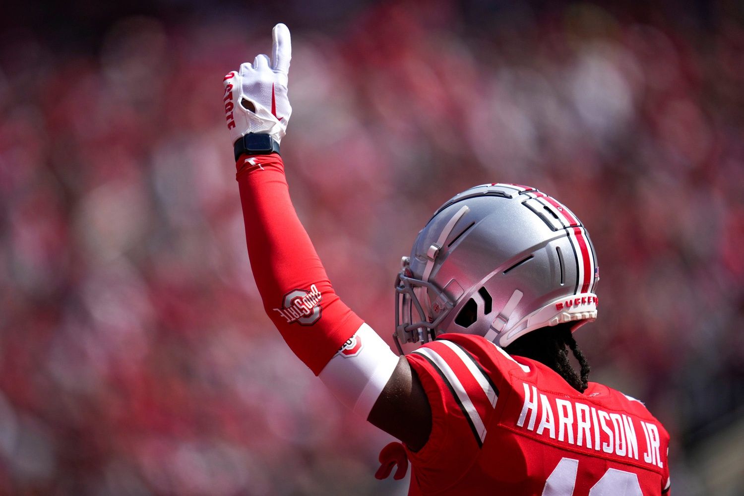 Marvin Harrison Jr. (18) points a finger to the sky after a successful catch during the first quarter.